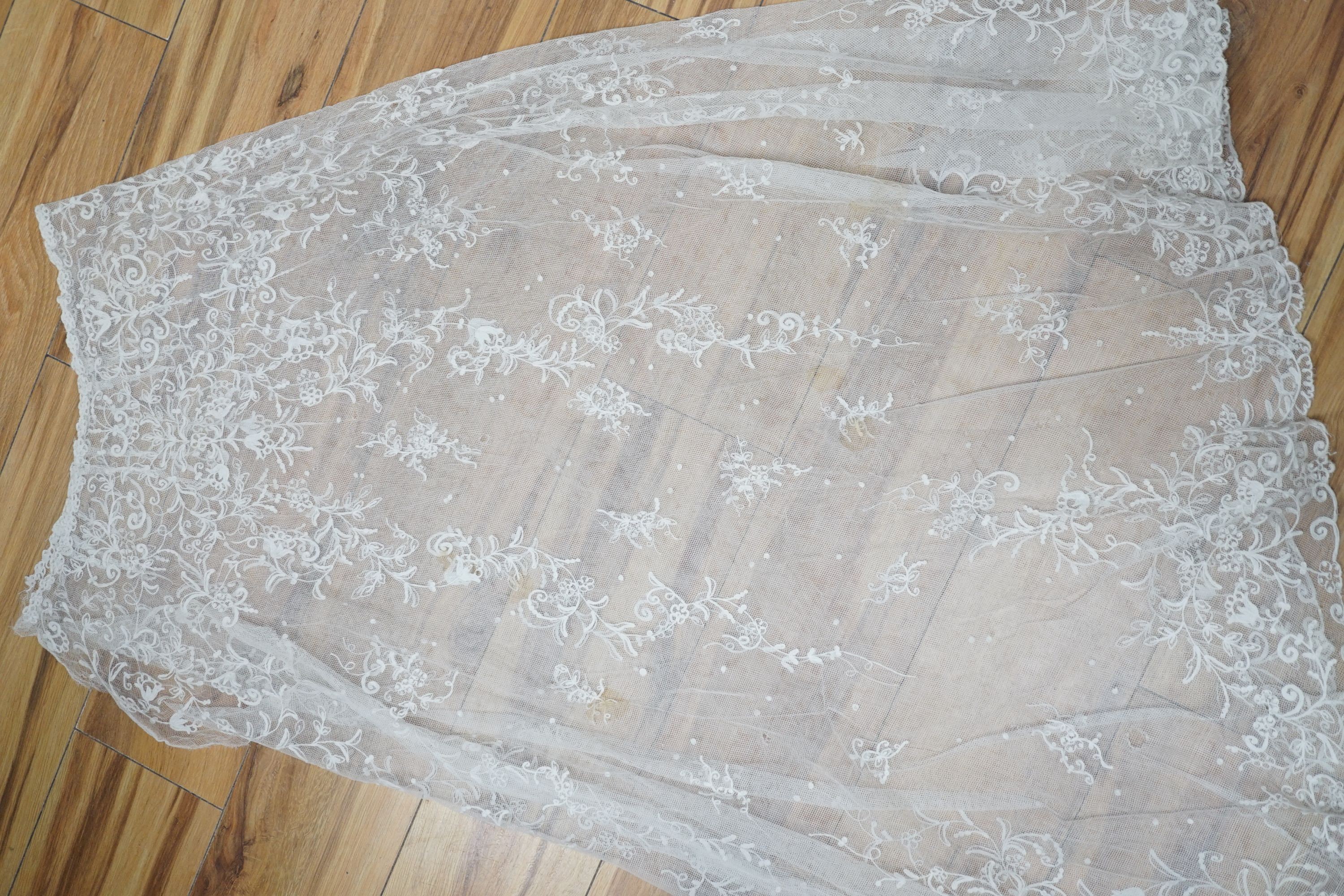 A needle lace skirt panel, a similar stole, various machine laces and trimmings